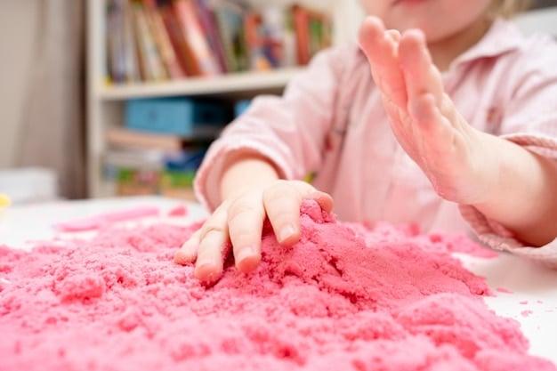 Child Playing with Pink Kinetic Sand